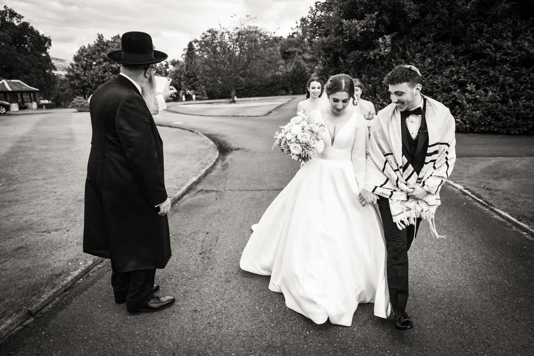 jewish wedding couple and rabbi