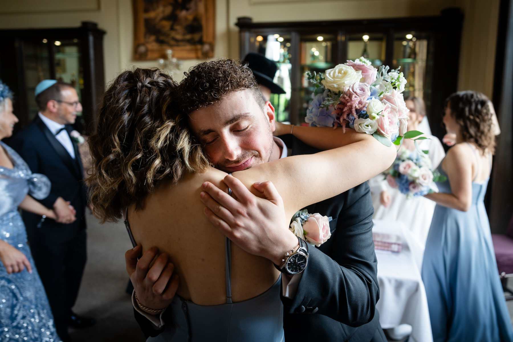 groom hugs sister